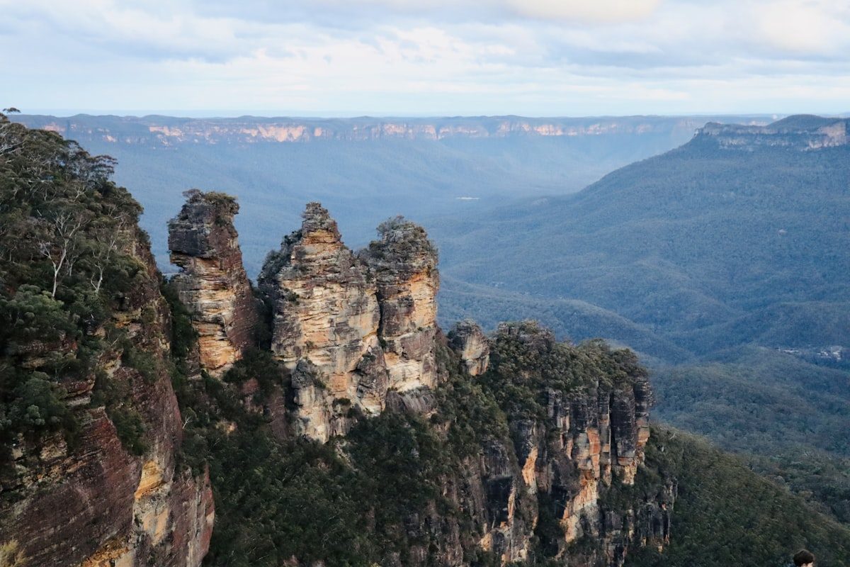Sandstone cliffs above the blue haze of the Blue Mountains