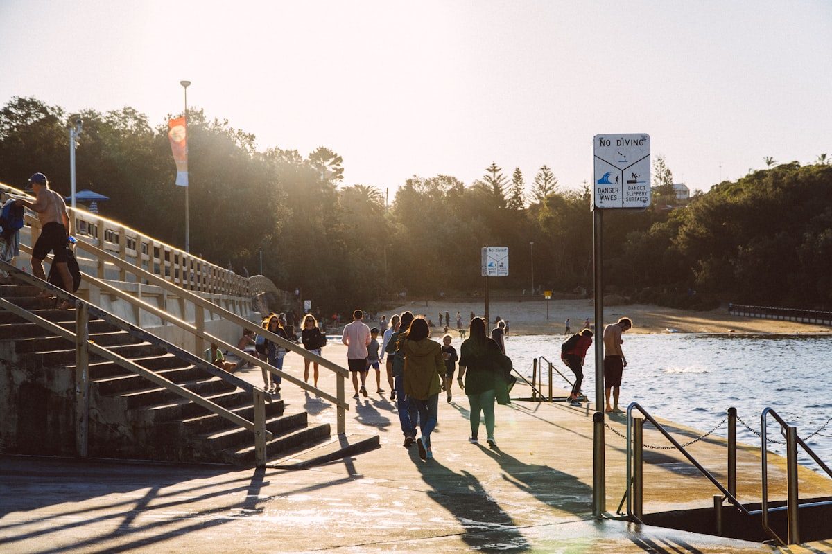 Golden afternoon on the concrete platforms of Clovelly's calm bay