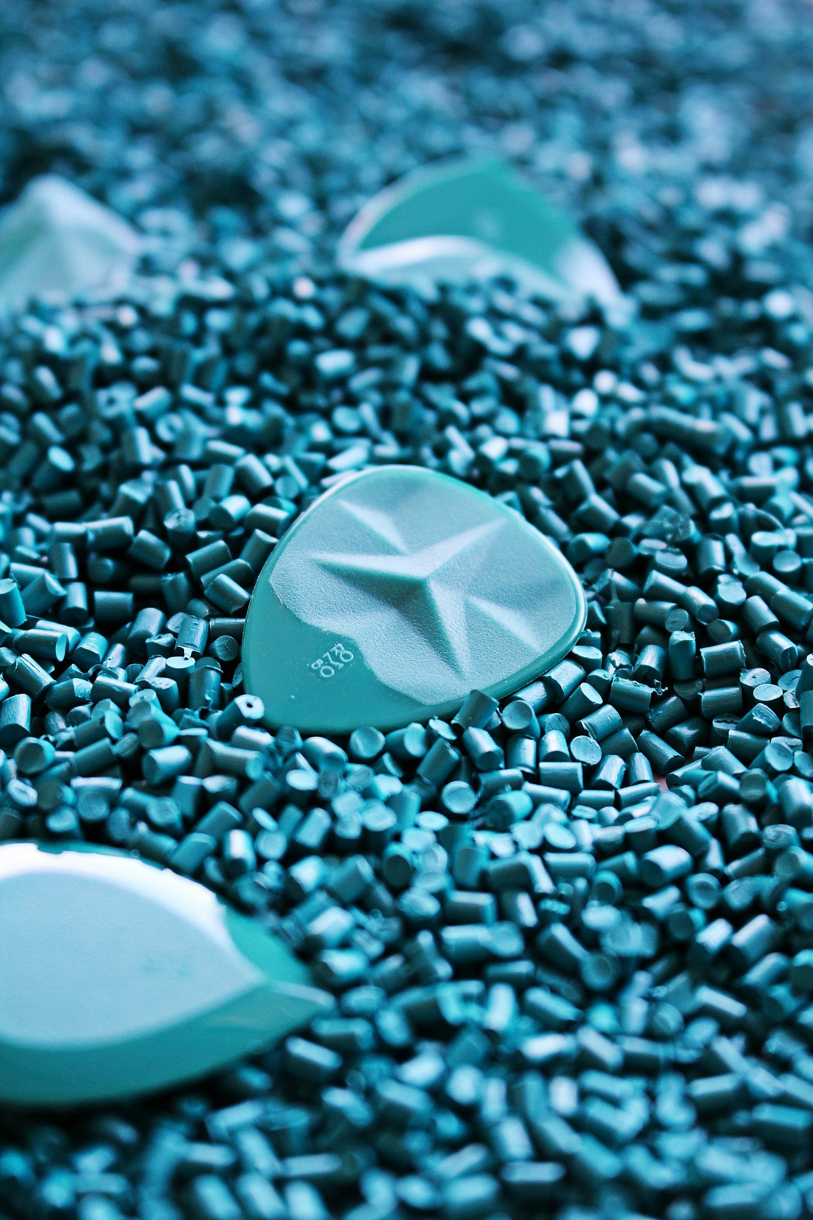 Small teal pellets, the shape of a seaweed made plastic alternative